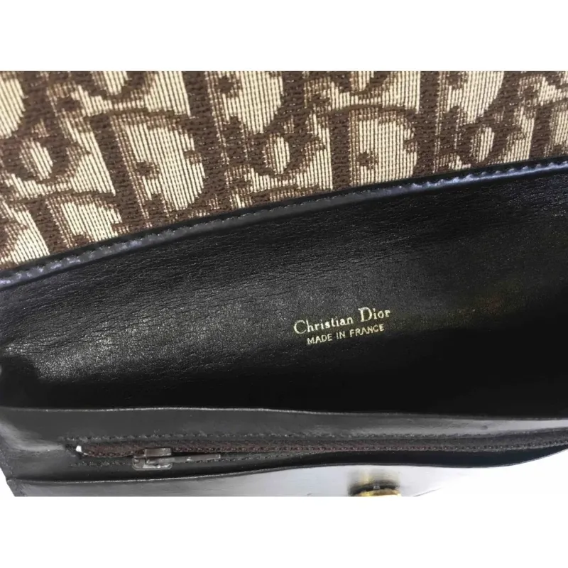 Portefeuille en cuir et toile monogramme
