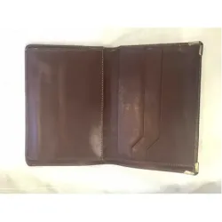 Porte-cartes / feuille en cuir bordeaux et bordures en métal doré
